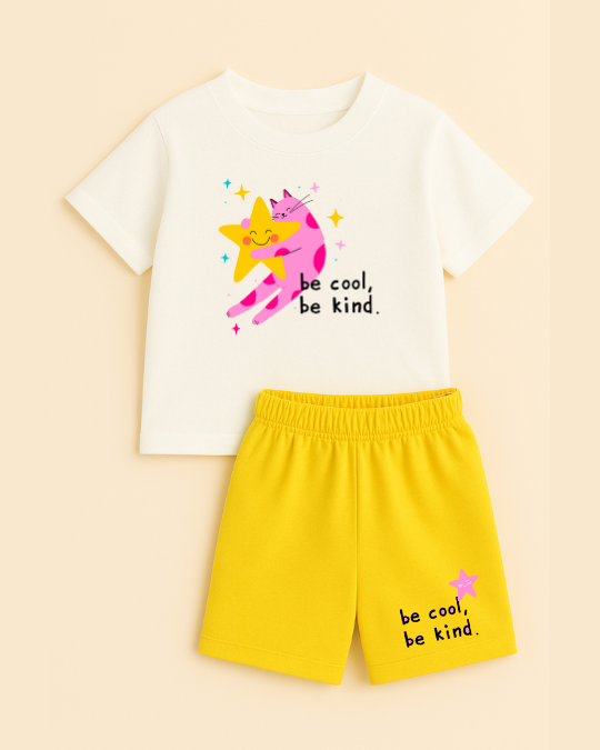 White t-shirt with cartoon design and yellow shorts on a beige background