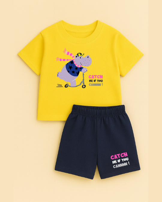 Yellow t-shirt with a cartoon hippo and shorts set on a beige background