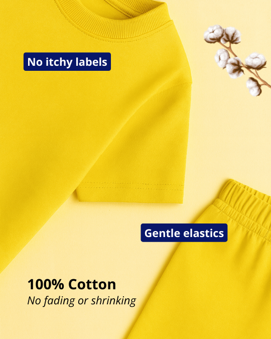 Yellow fabric with text about no itchy labels, gentle elastics, 100% cotton, no fading or shrinking on a yellow background.