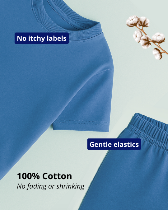 Blue children's pants with text highlighting features on a light green background