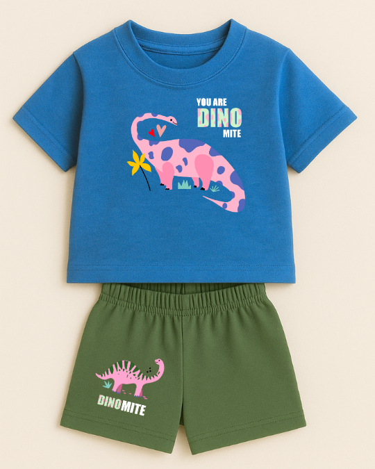 Children's blue t-shirt and green shorts set with dinosaur graphics on a beige background