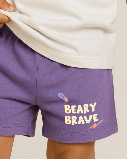 Purple shorts with 'BEARY BRAVE' text and graphics on a neutral background