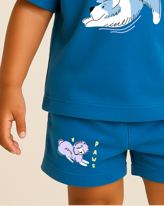 Child wearing a blue outfit with a cartoon dog design on a beige background