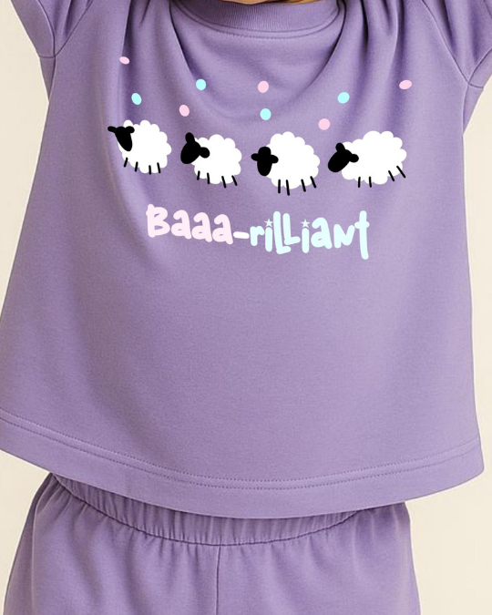 Purple outfit with sheep design and 'Baaa-lliant' text on a beige background