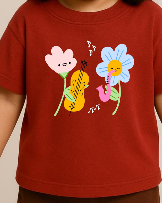 Red t-shirt with cartoon flowers playing musical instruments on a plain background