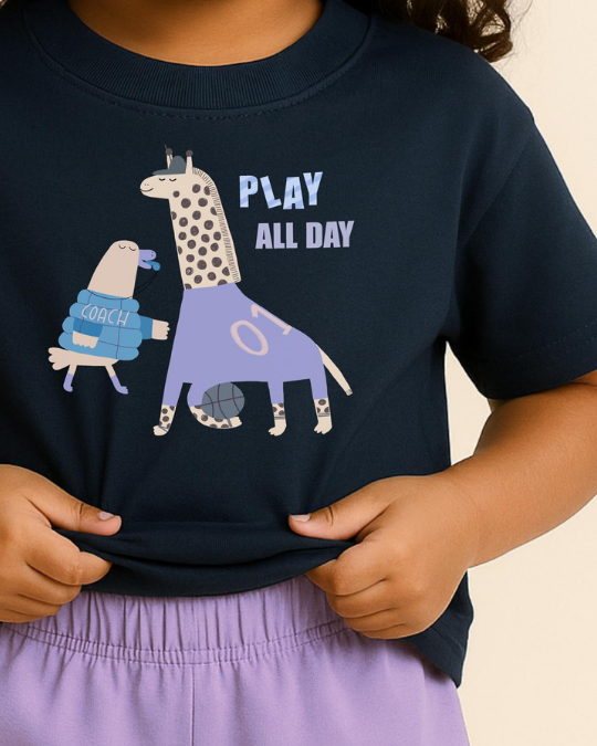 Child wearing a navy blue t-shirt with a cartoon giraffe and text design.
