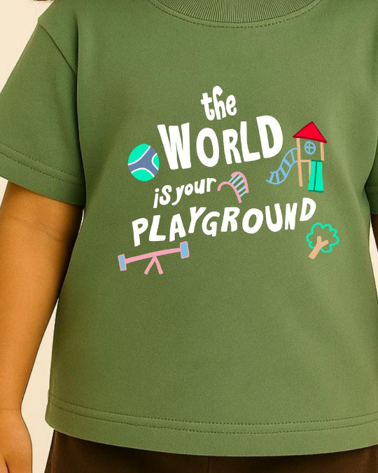 Green t-shirt with 'the world is your playground' text and graphics on a plain background