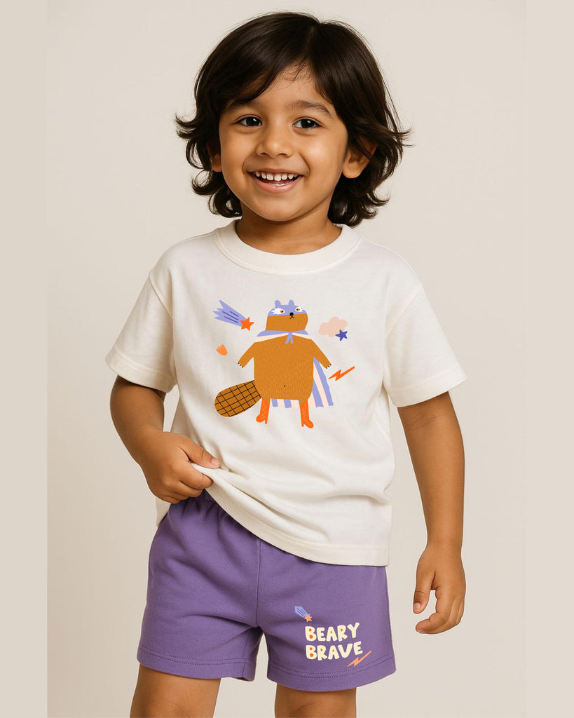 Child wearing a white t-shirt with a bear graphic and purple shorts with 'Beary Brave' text on a plain background