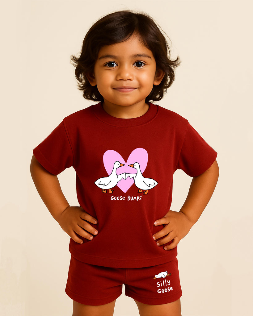 Child wearing a red outfit with a graphic design on a beige background